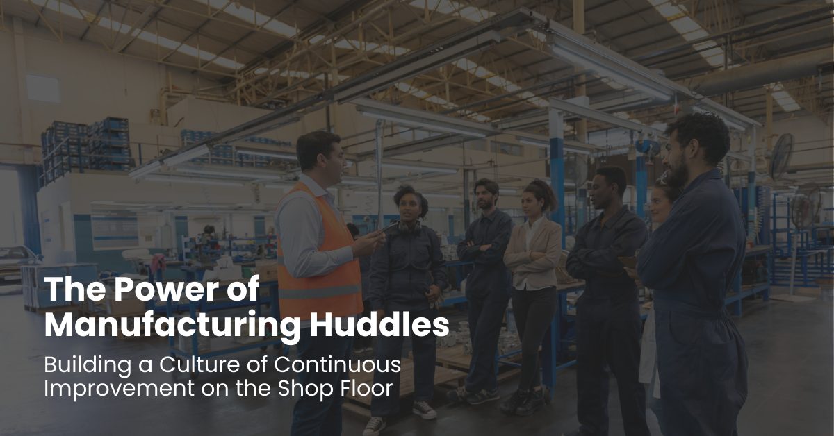Manufacturing team gathered for a shift huddle on the plant floor